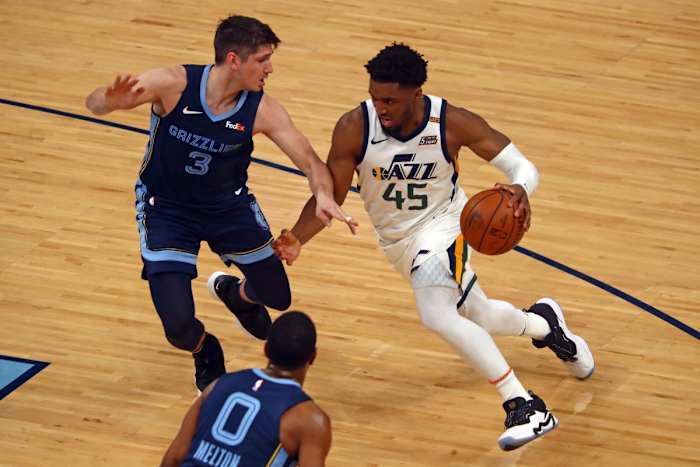 Donovan Mitchell (45) drives past Grayson Allen (3) for an easy bucket